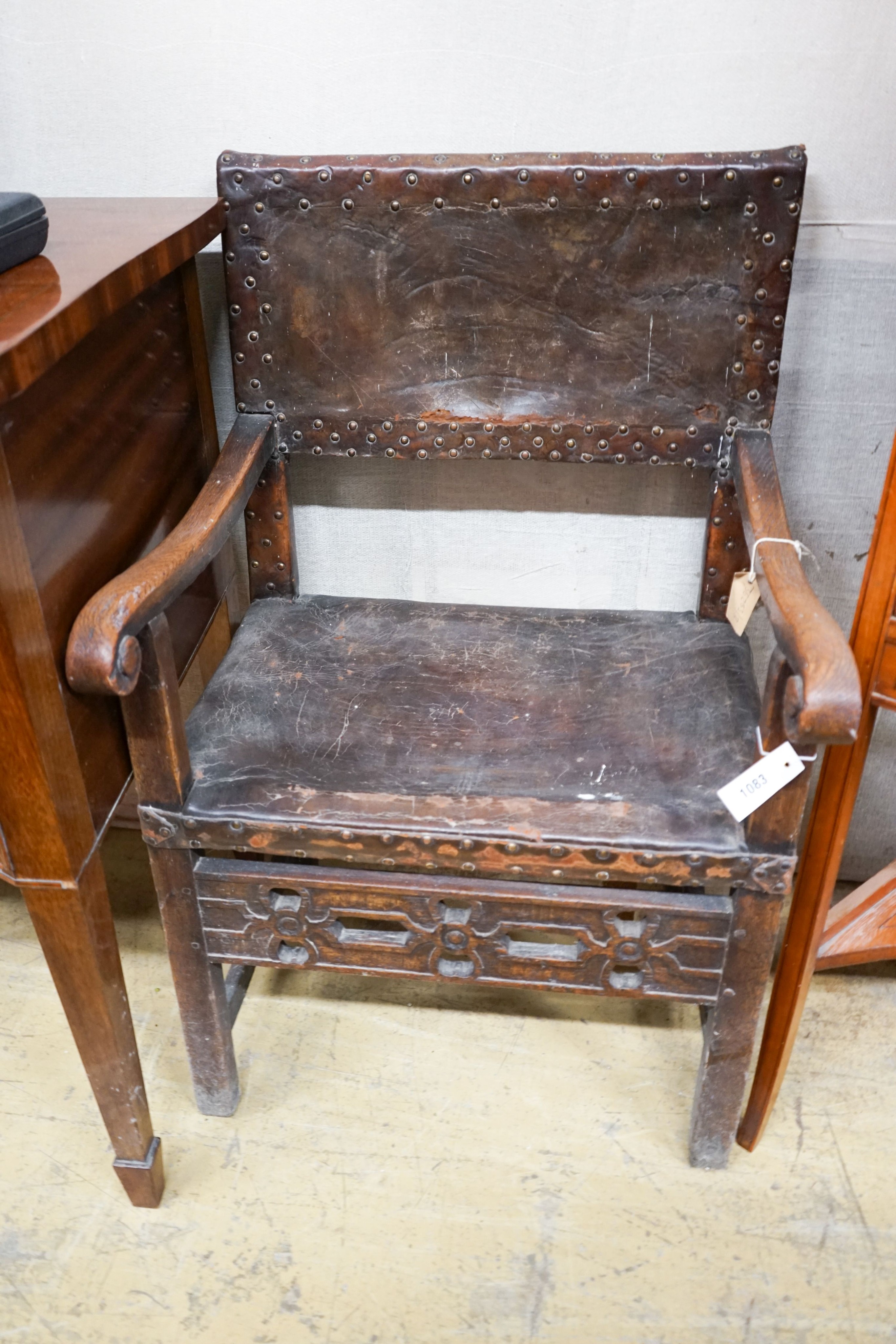 An 18th century oak elbow chair, width 59cm, depth 54cm, height 96cm